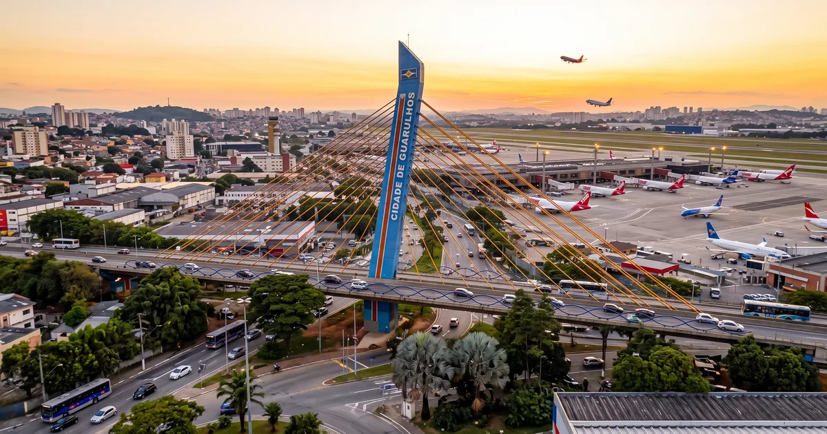 Illustration of Guarulhos at dusk, with the cable-stayed viaduct, the airport apron and the city skyline